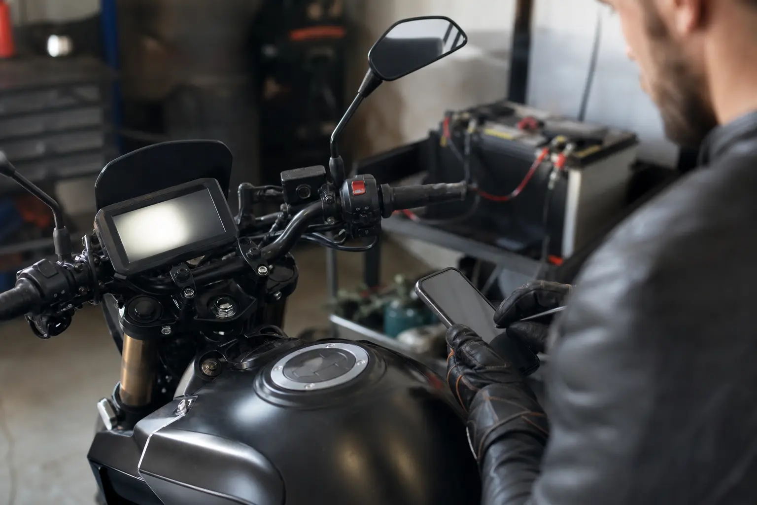 Motorcyclist documenting intermittent electrical symptoms before service.