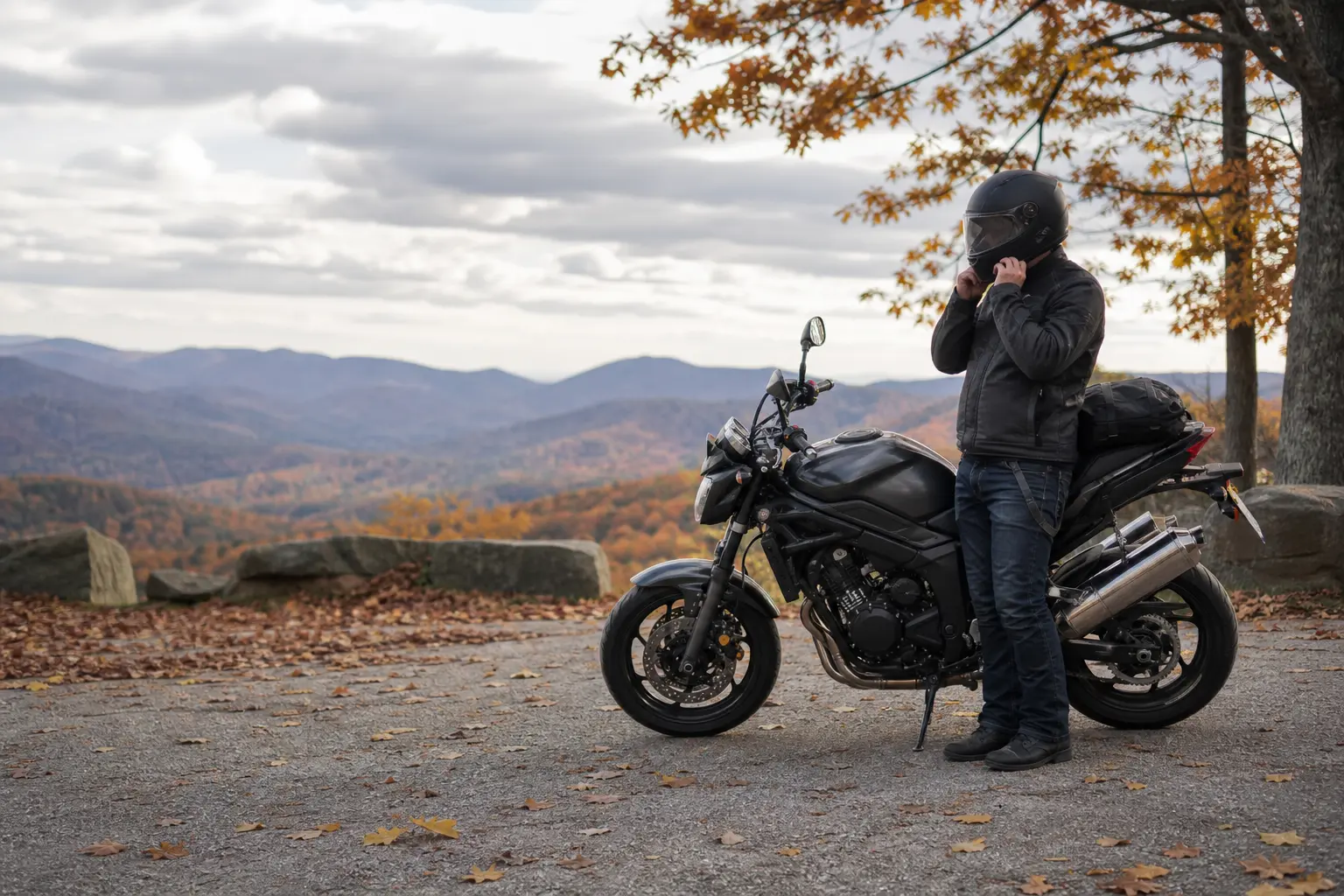 Rider preparing motorcycle gear before an autumn ride.